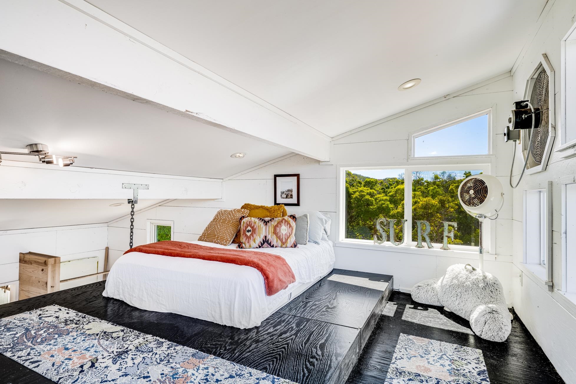 796 Awalau Road Haiku, HI 96708 - Photo 46 of 50 a bedroom with a bed and wooden floor