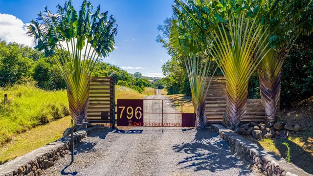 an aerial view of a house with a yard basket ball court and outdoor seating