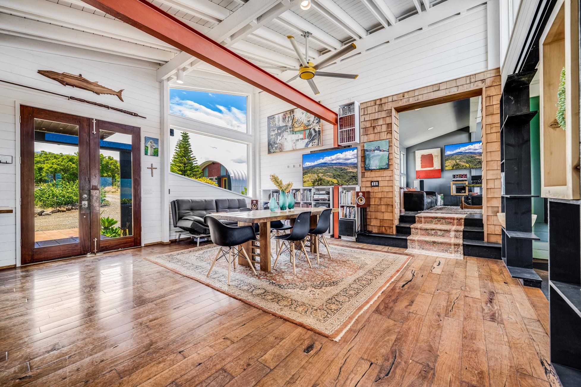 796 Awalau Road Haiku, HI 96708 - Photo 5 of 50 a living room with furniture a wooden floor and next to a large window