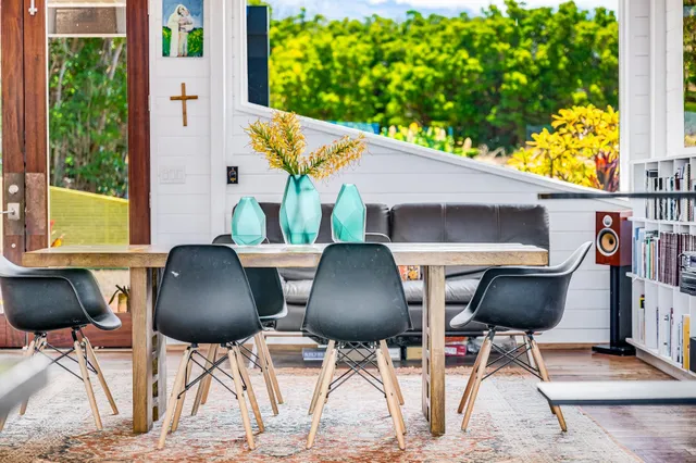 a view of balcony with table and chairs