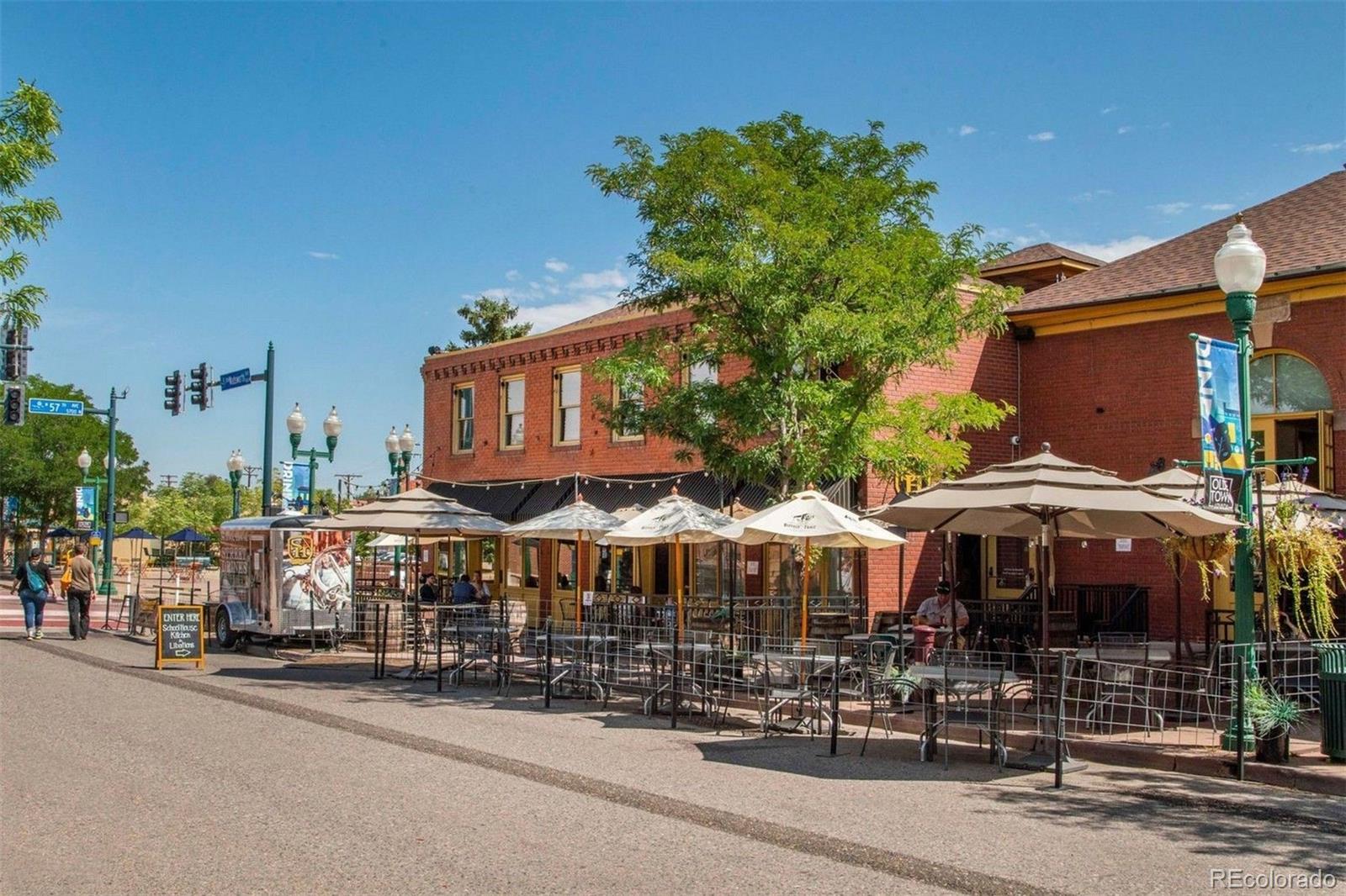 5189 Carr Street Arvada, CO 80002 - Photo 27 of 30 a street sign on a street in front of building