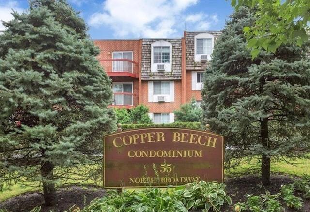 55 North Broadway, Unit 211 White Plains, NY 10601 - Photo 1 of 1 a sign on the side of a building