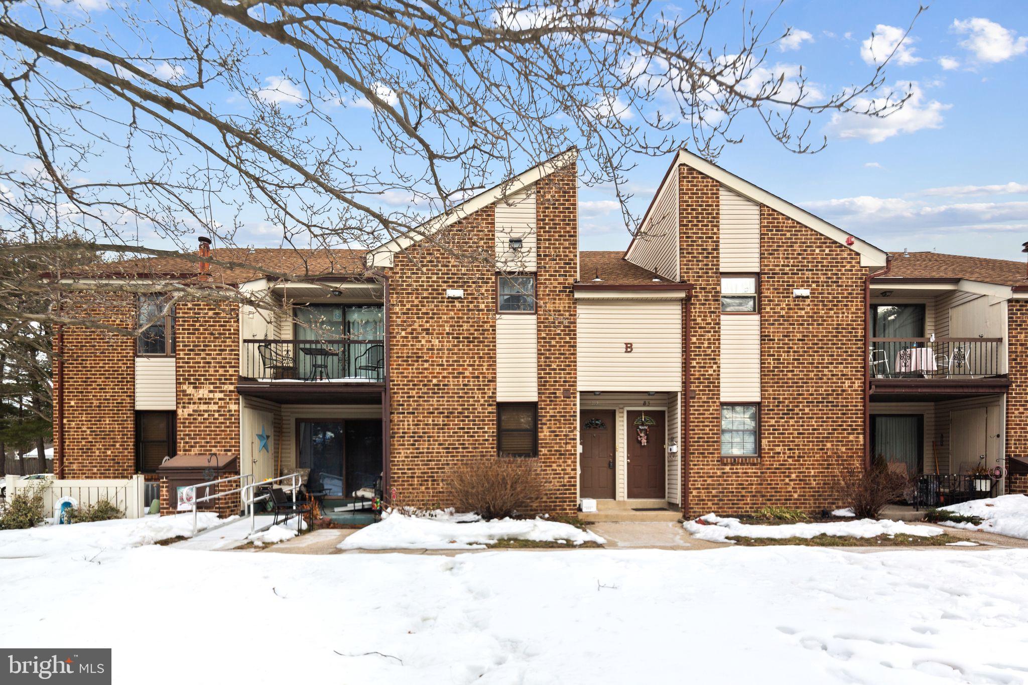 1475 Mt Holly Road, Unit B2 Edgewater Park, NJ 08010 - Photo 1 of 14 Charming brick facade in a winter landscape.