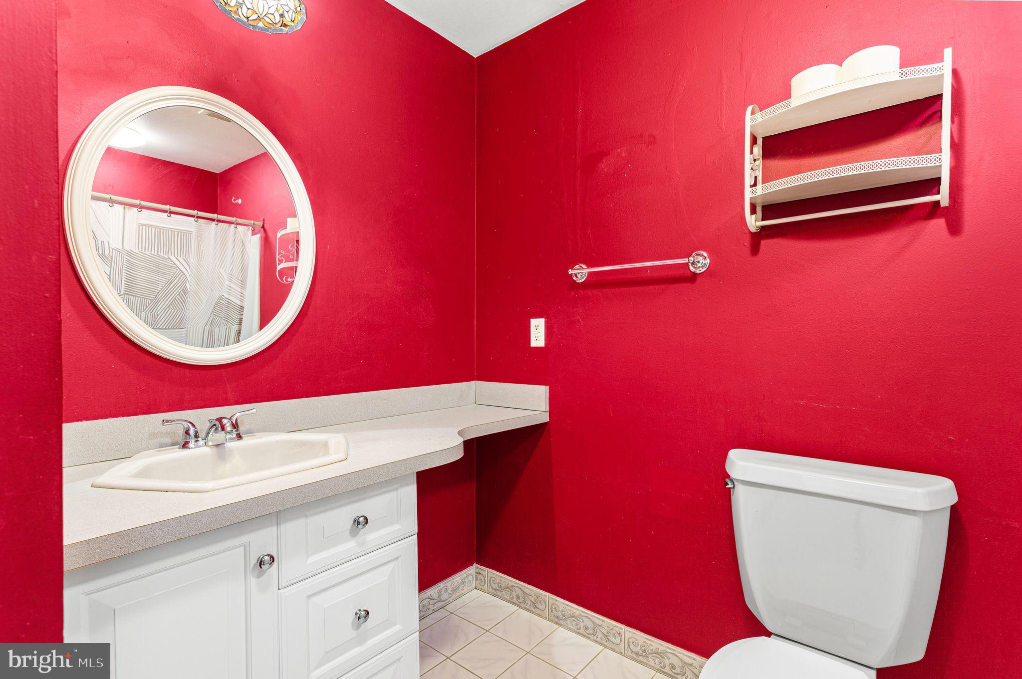 1475 Mt Holly Road, Unit B2 Edgewater Park, NJ 08010 - Photo 11 of 14 Vibrant red bathroom with modern accents.
