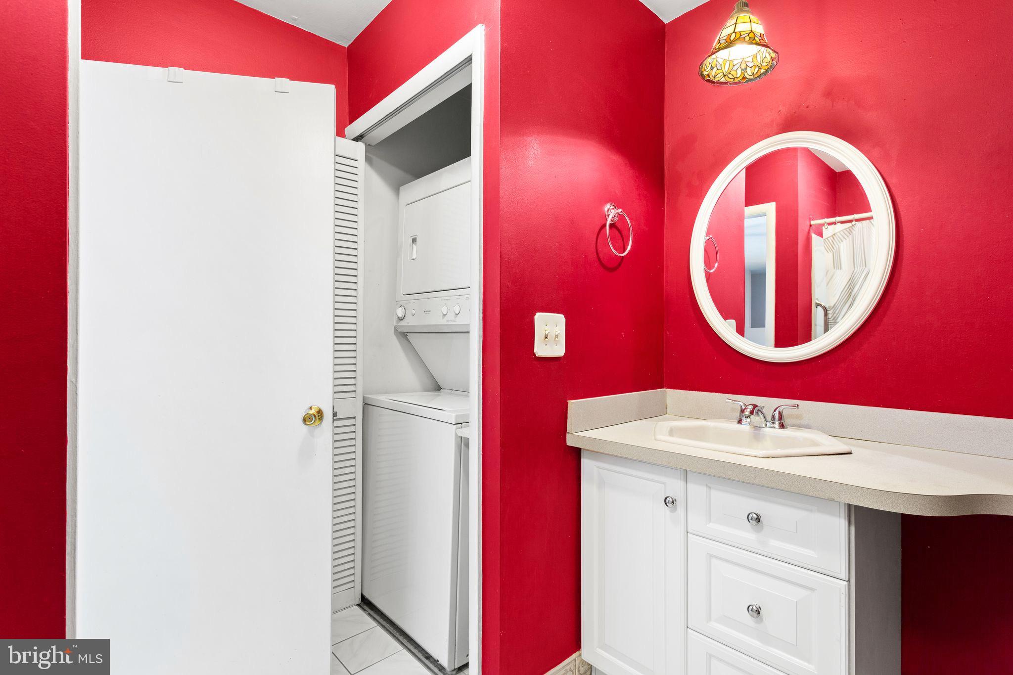 1475 Mt Holly Road, Unit B2 Edgewater Park, NJ 08010 - Photo 12 of 14 Vibrant red accents in a modern bathroom.
