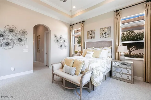 a bedroom with a bed and a couch