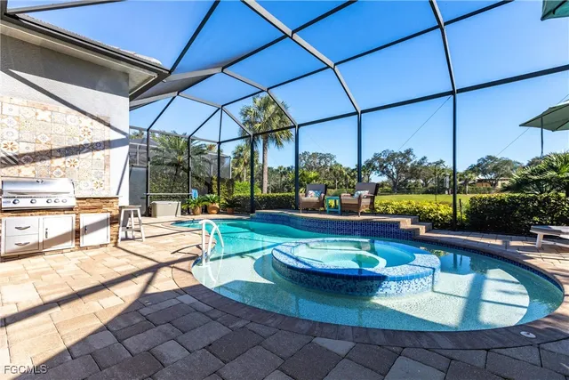 a view of a swimming pool with a lounge chairs