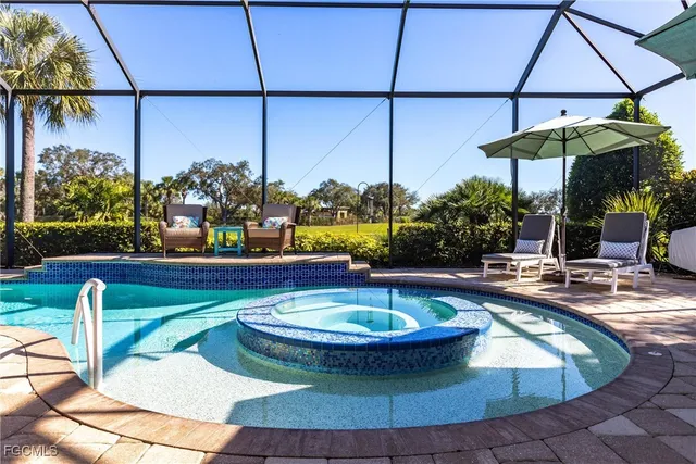 a view of a swimming pool with a patio