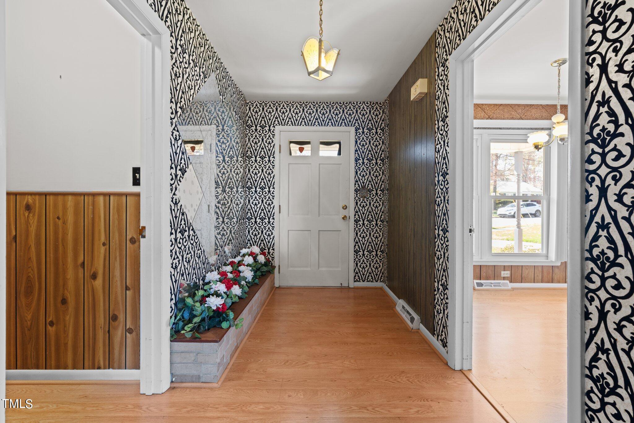 4705 Latimer Road Raleigh, NC 27609 - Photo 19 of 51 a view of an entryway with a flower pot