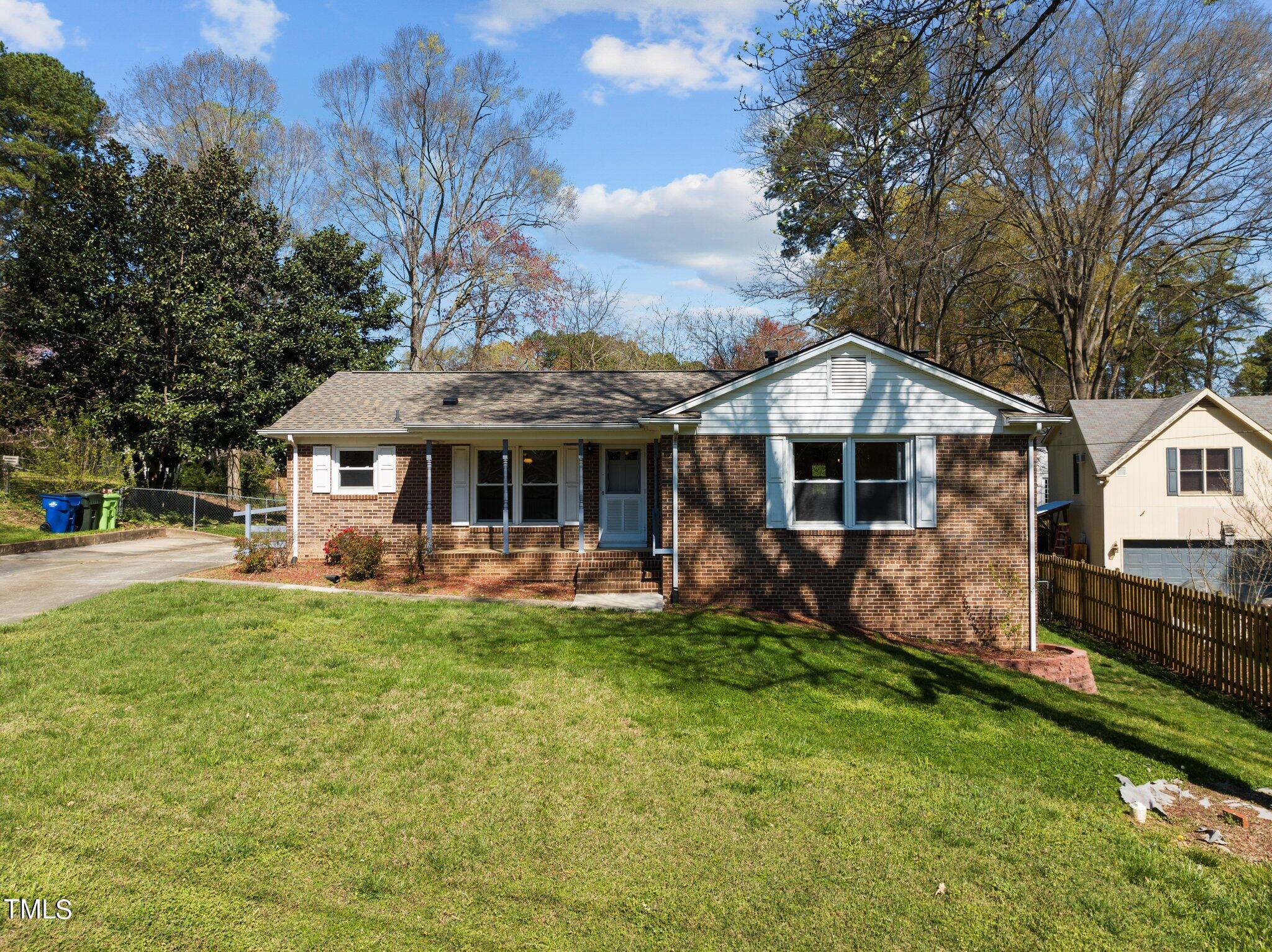 4705 Latimer Road Raleigh, NC 27609 - Photo 2 of 51 a front view of a house with a yard porch and furniture