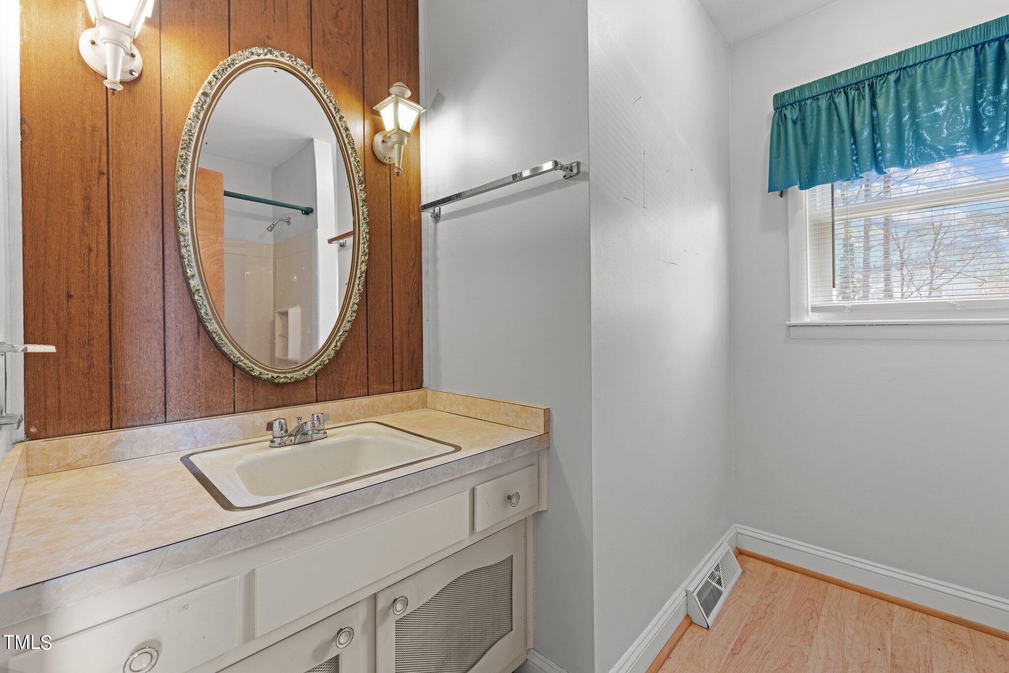 4705 Latimer Road Raleigh, NC 27609 - Photo 28 of 51 a bathroom with a sink and a mirror