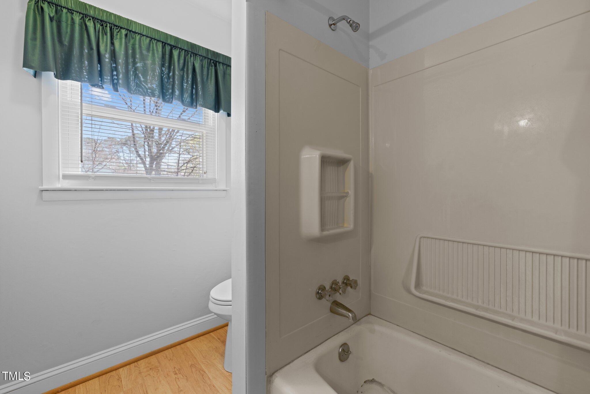 4705 Latimer Road Raleigh, NC 27609 - Photo 29 of 51 a bathroom with a bathtub and shower