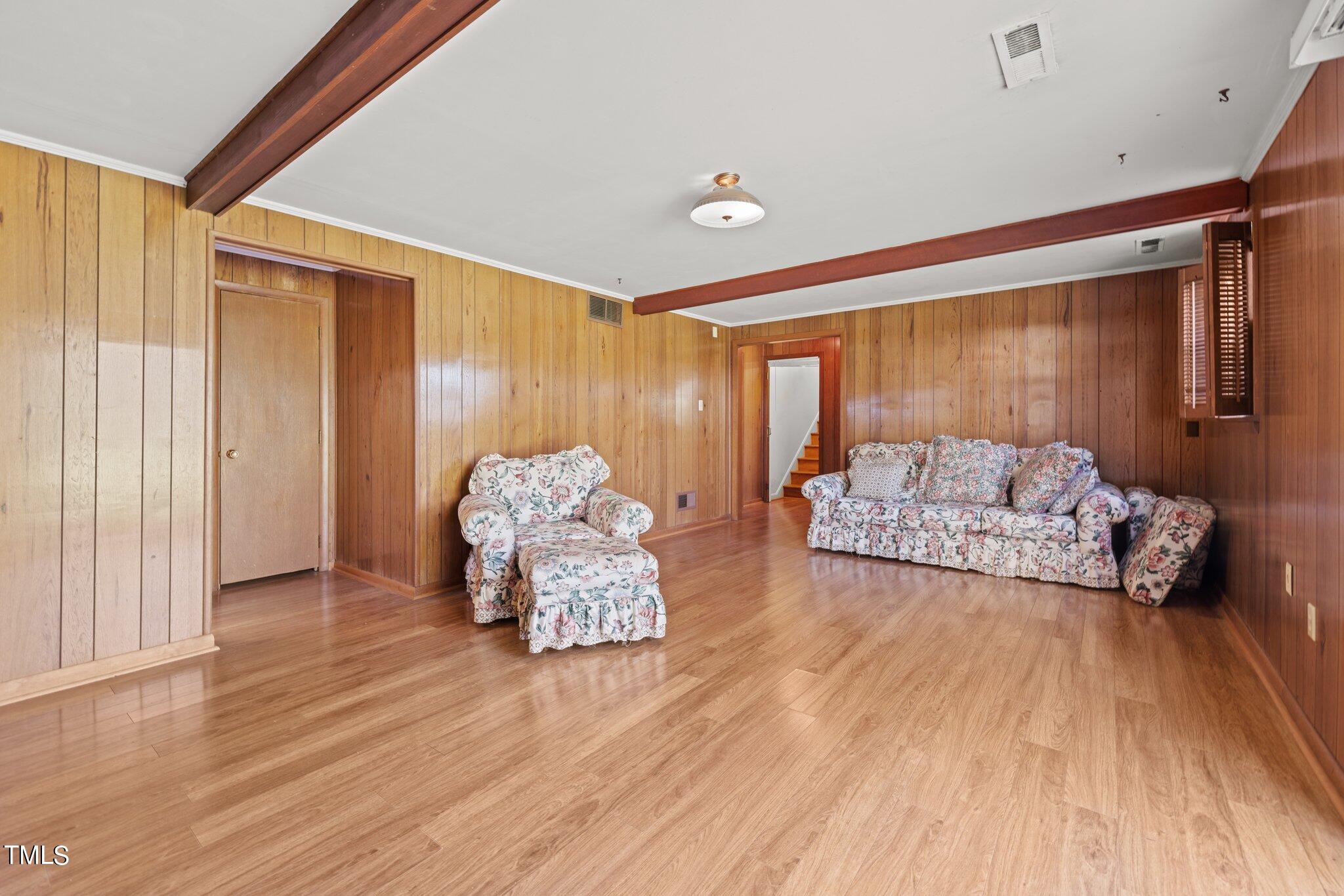 4705 Latimer Road Raleigh, NC 27609 - Photo 33 of 51 a living room with furniture and a large window