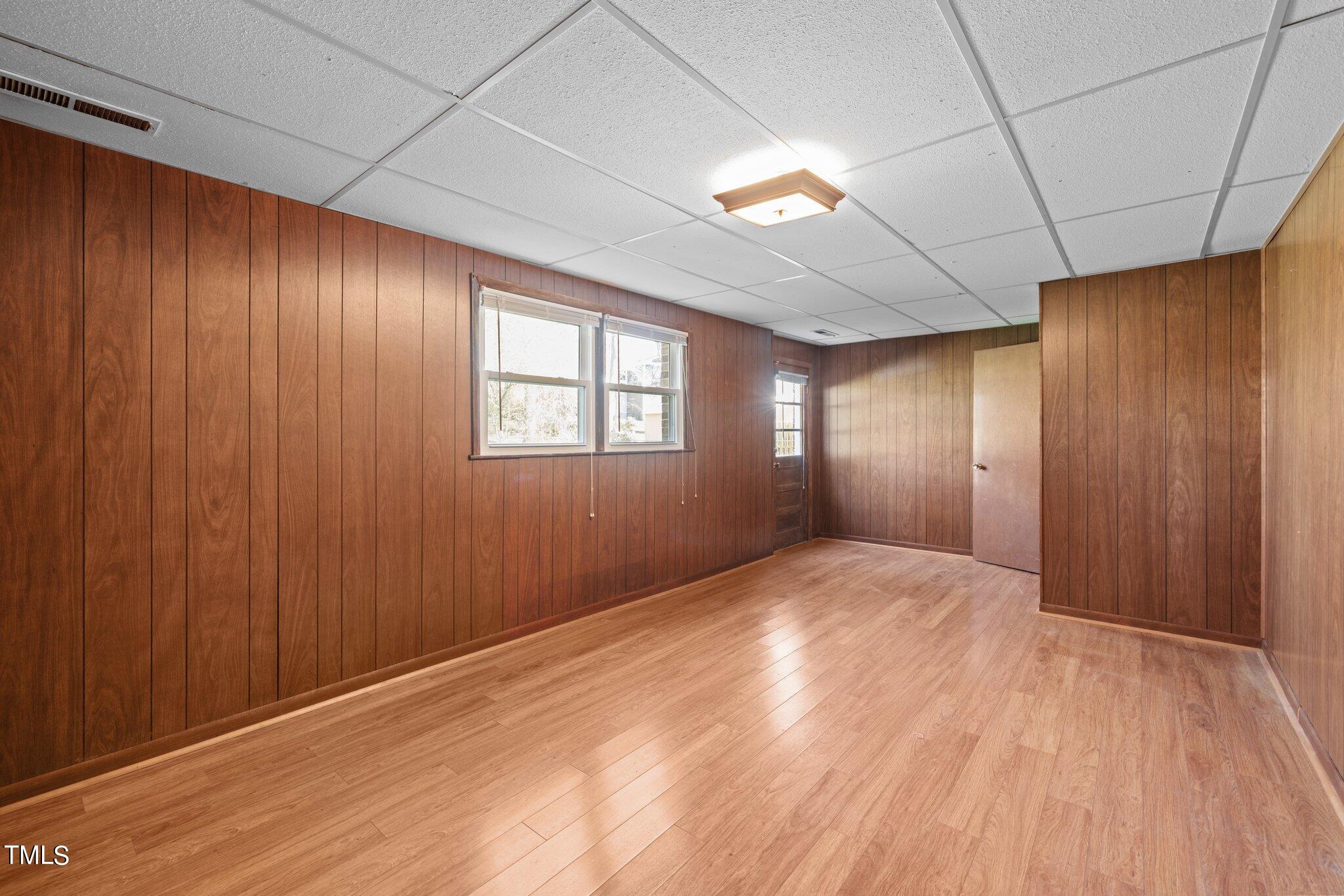 4705 Latimer Road Raleigh, NC 27609 - Photo 35 of 51 a view of empty room with wooden floor