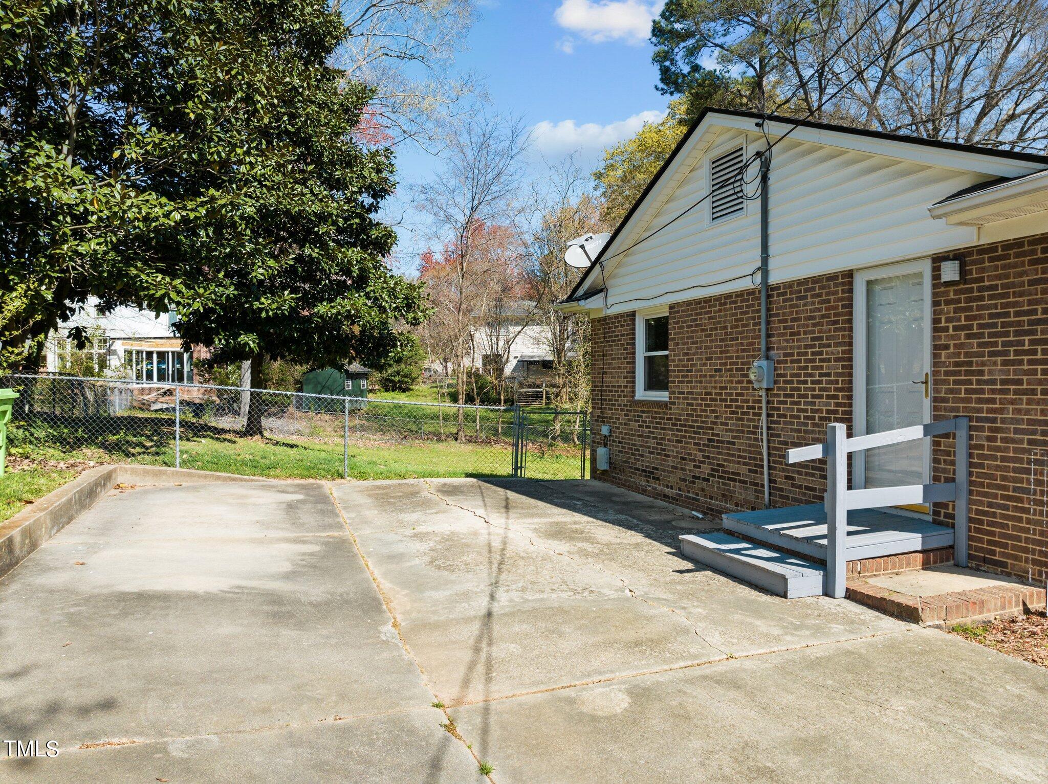 4705 Latimer Road Raleigh, NC 27609 - Photo 40 of 51 a view of a house with a swimming pool