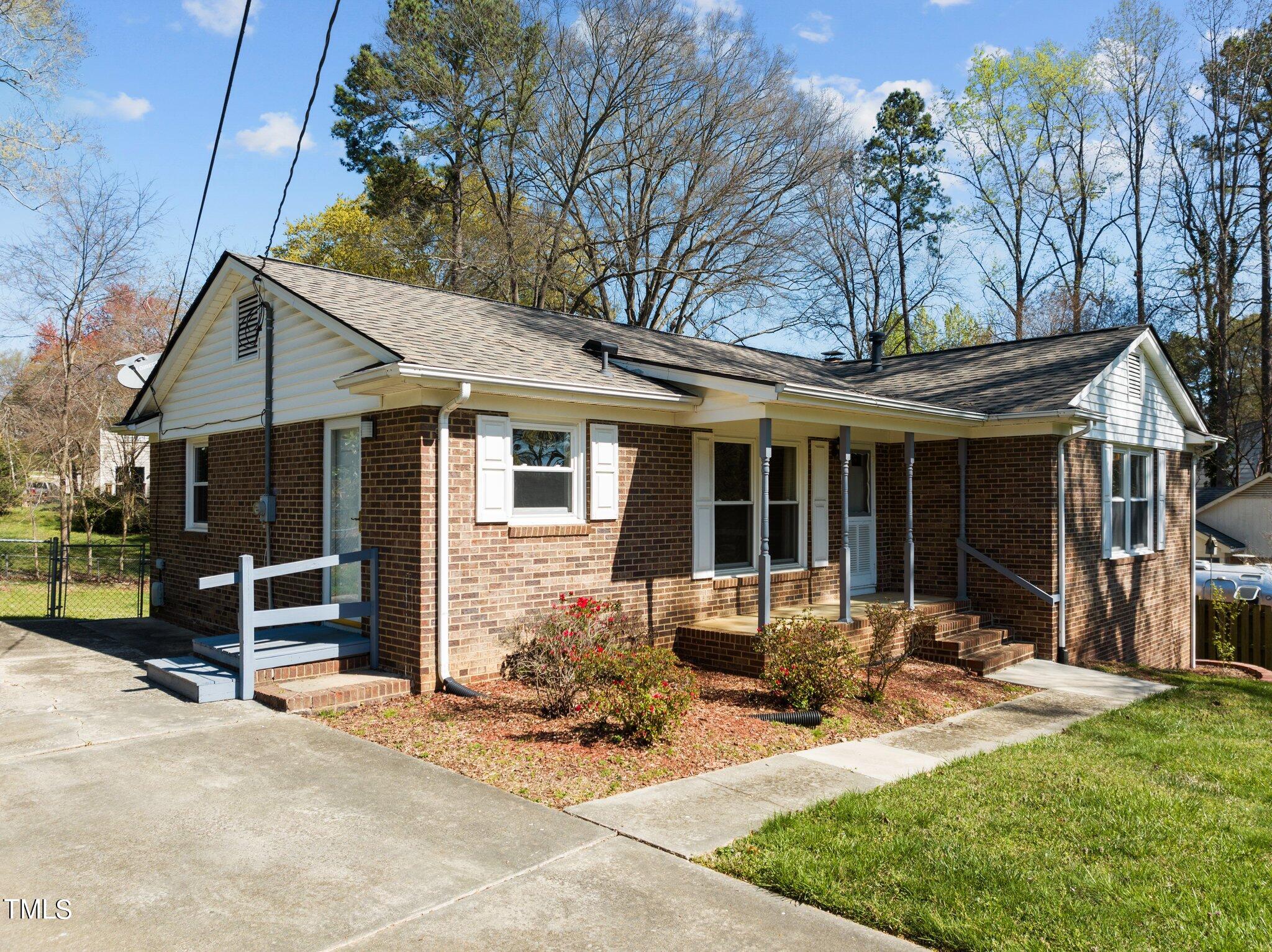 4705 Latimer Road Raleigh, NC 27609 - Photo 4 of 51 a front view of a house with patio