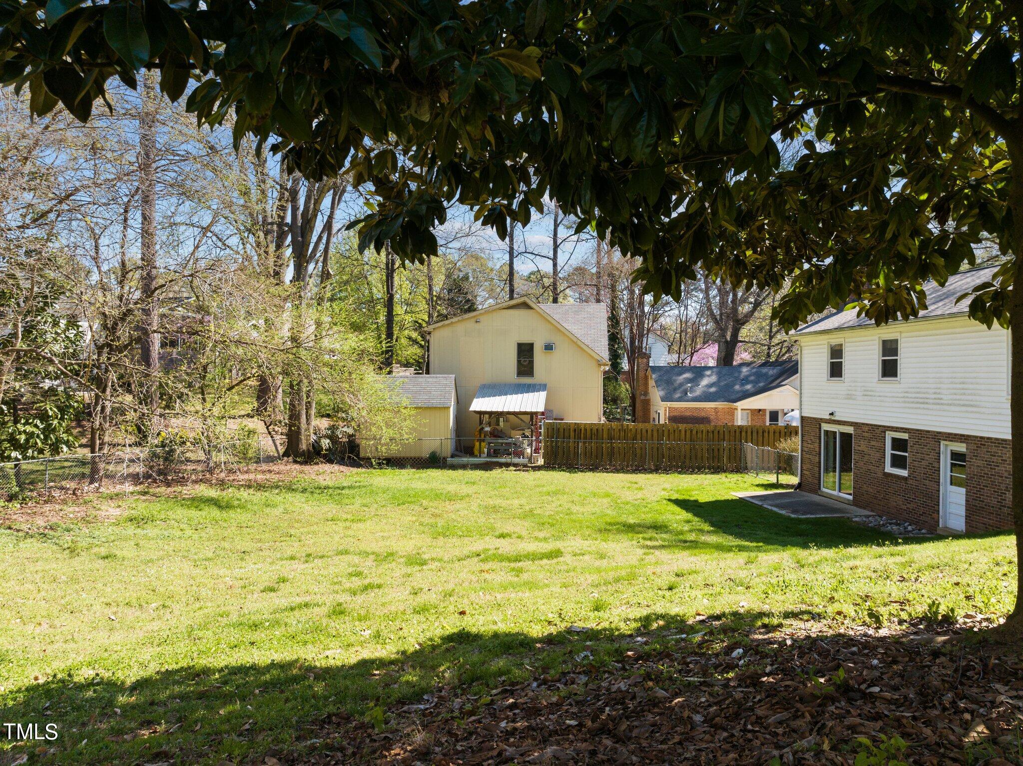 4705 Latimer Road Raleigh, NC 27609 - Photo 41 of 51 a front view of a house with a yard