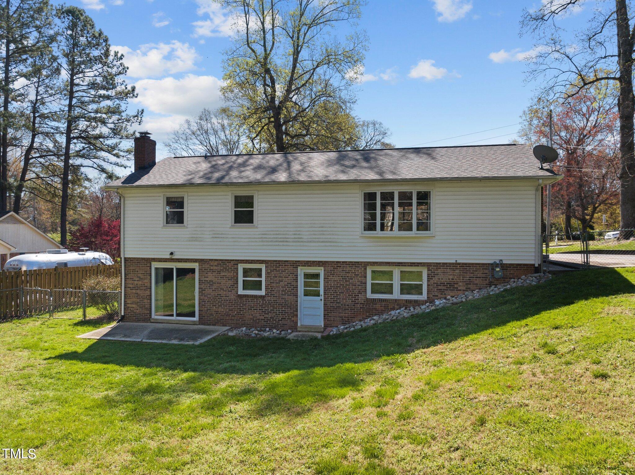 4705 Latimer Road Raleigh, NC 27609 - Photo 43 of 51 a front view of a house with yard and green space