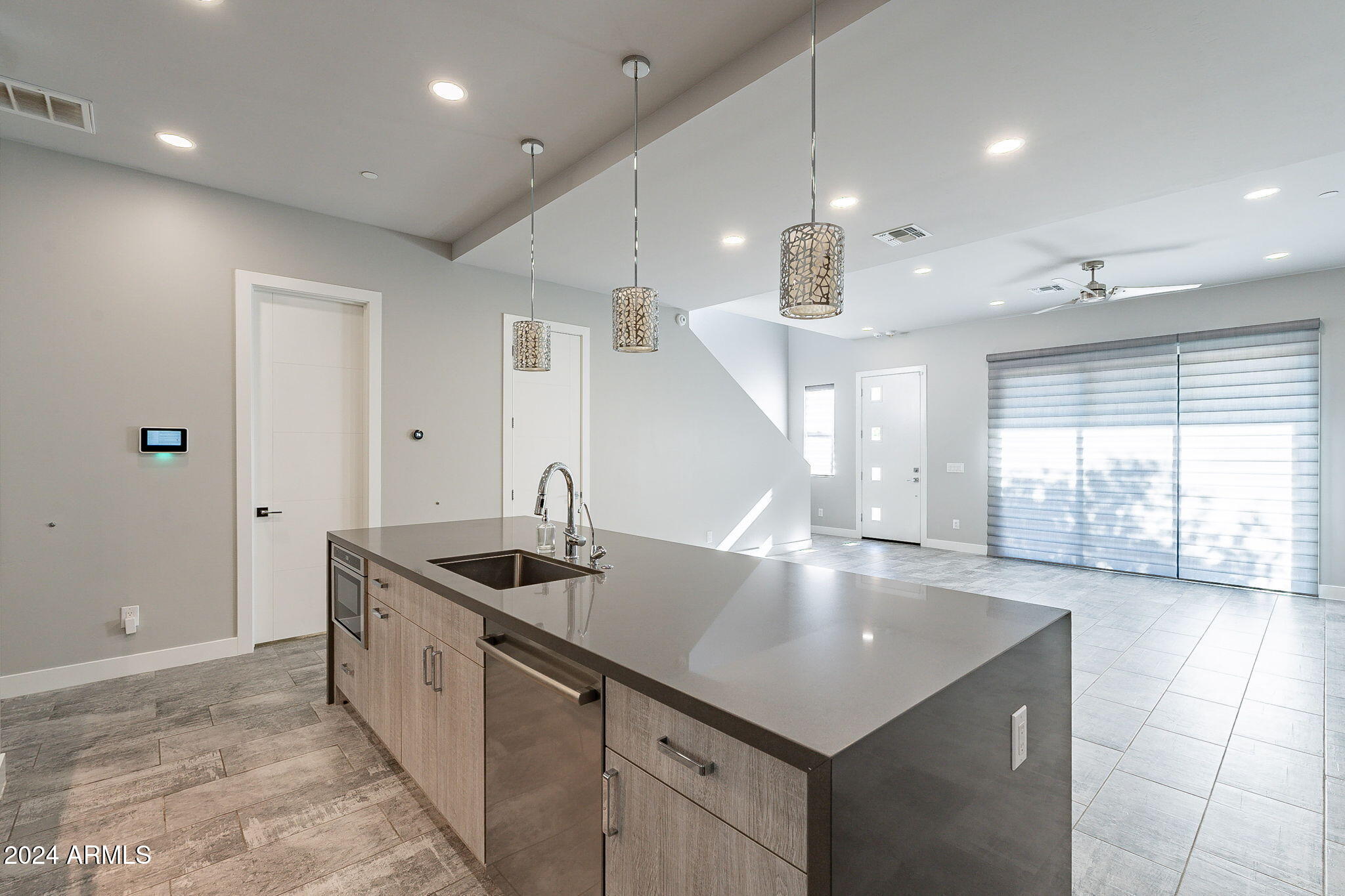 2645 East Osborn Road, Unit 3 Phoenix, AZ 85016 - Photo 11 of 31 a kitchen with stainless steel appliances granite countertop a sink and a large window
