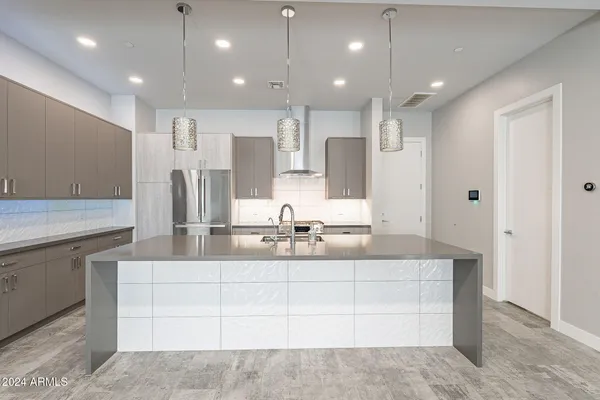 a bathroom with a sink vanity and a mirror