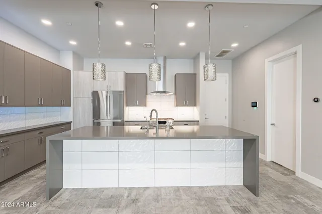 a bathroom with a sink vanity and a mirror