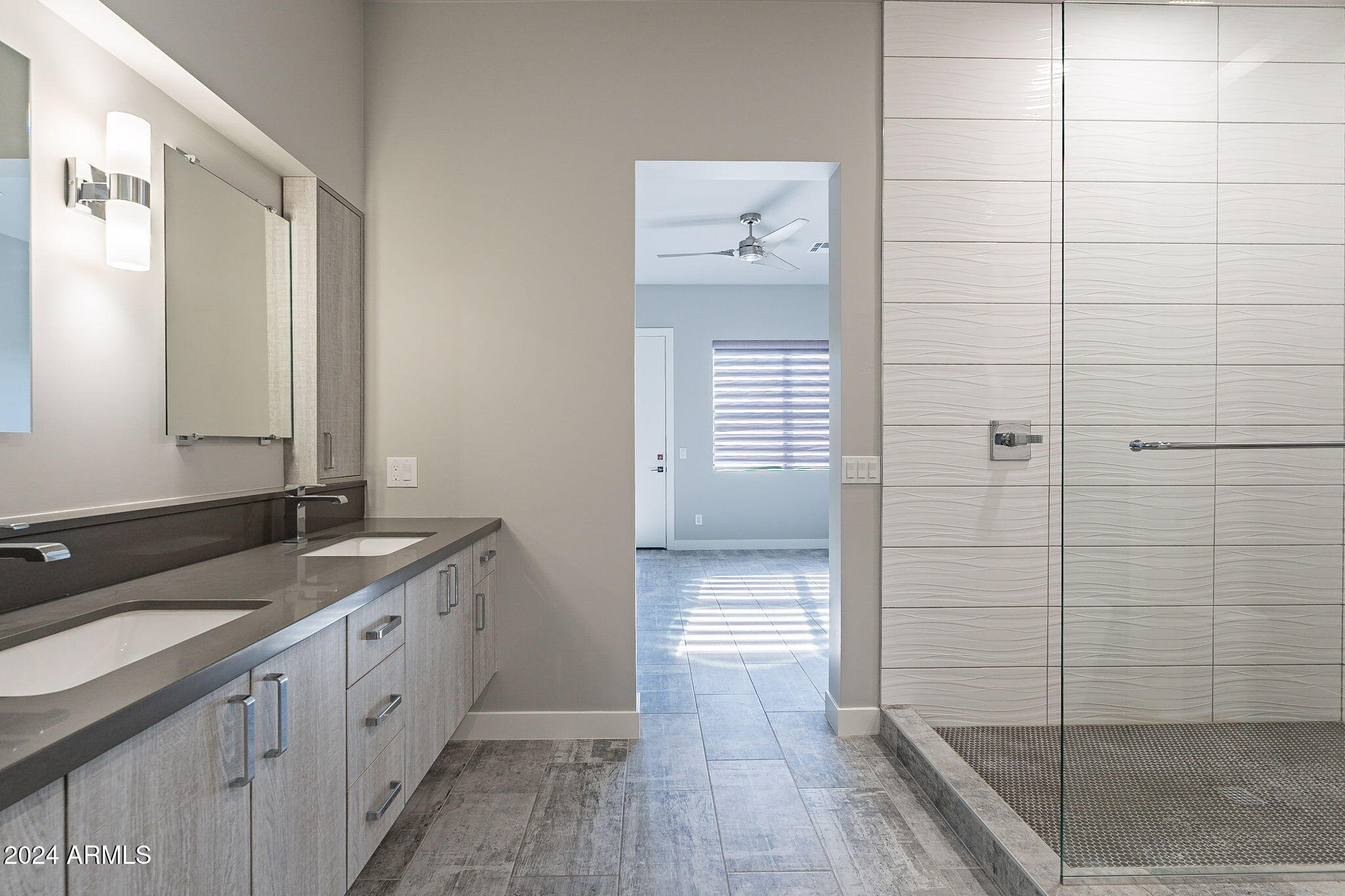 2645 East Osborn Road, Unit 3 Phoenix, AZ 85016 - Photo 19 of 31 a spacious bathroom with a granite countertop sink a mirror and shower