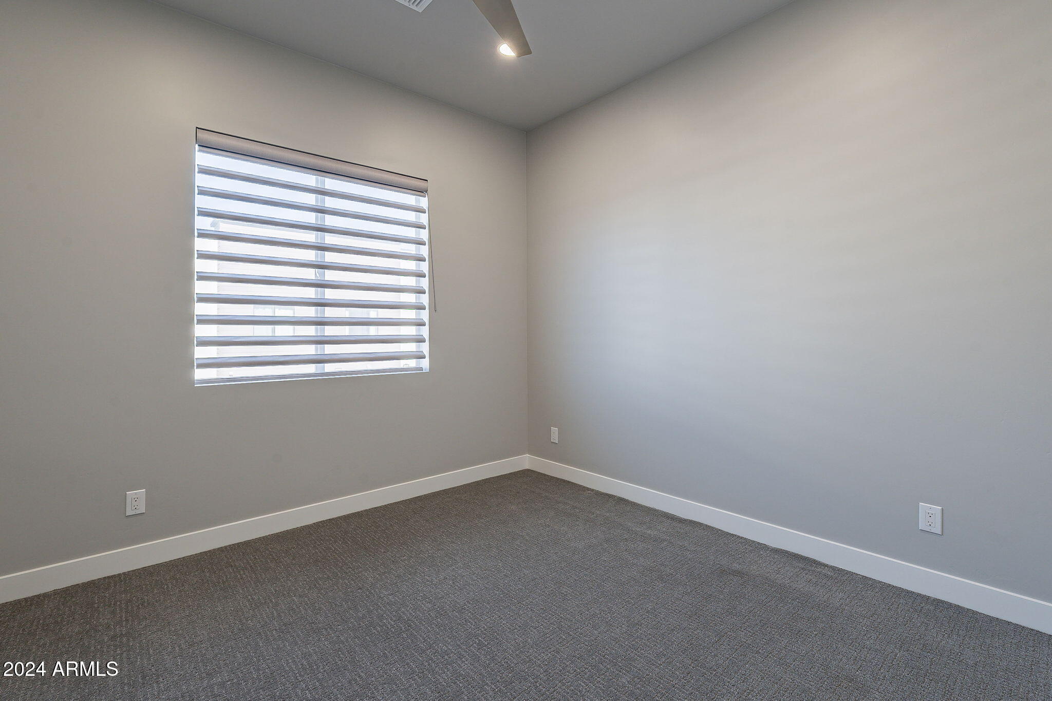 2645 East Osborn Road, Unit 3 Phoenix, AZ 85016 - Photo 24 of 31 an empty room with a window