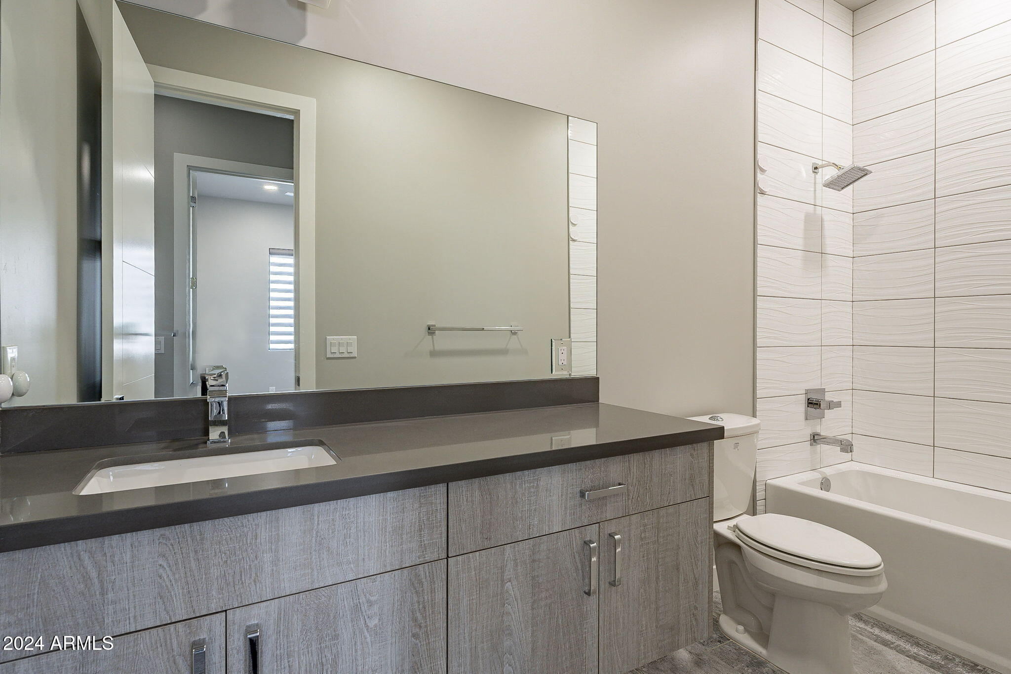 2645 East Osborn Road, Unit 3 Phoenix, AZ 85016 - Photo 26 of 31 a bathroom with a granite countertop sink toilet and shower
