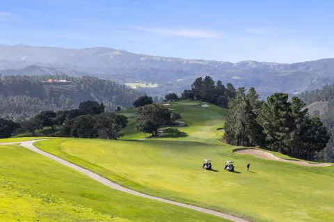 a view of a swimming pool and a yard