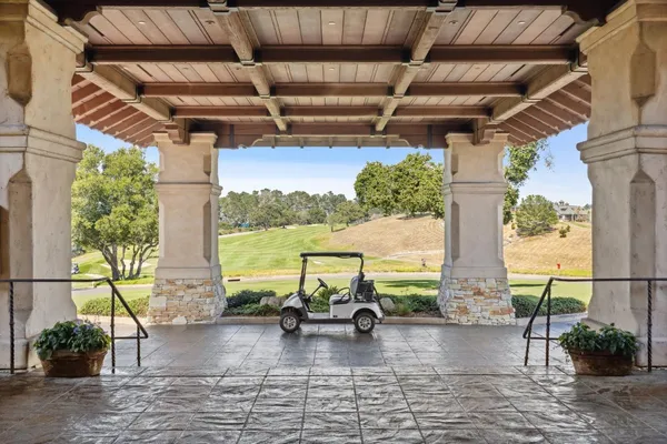 a view of a backyard with sitting area