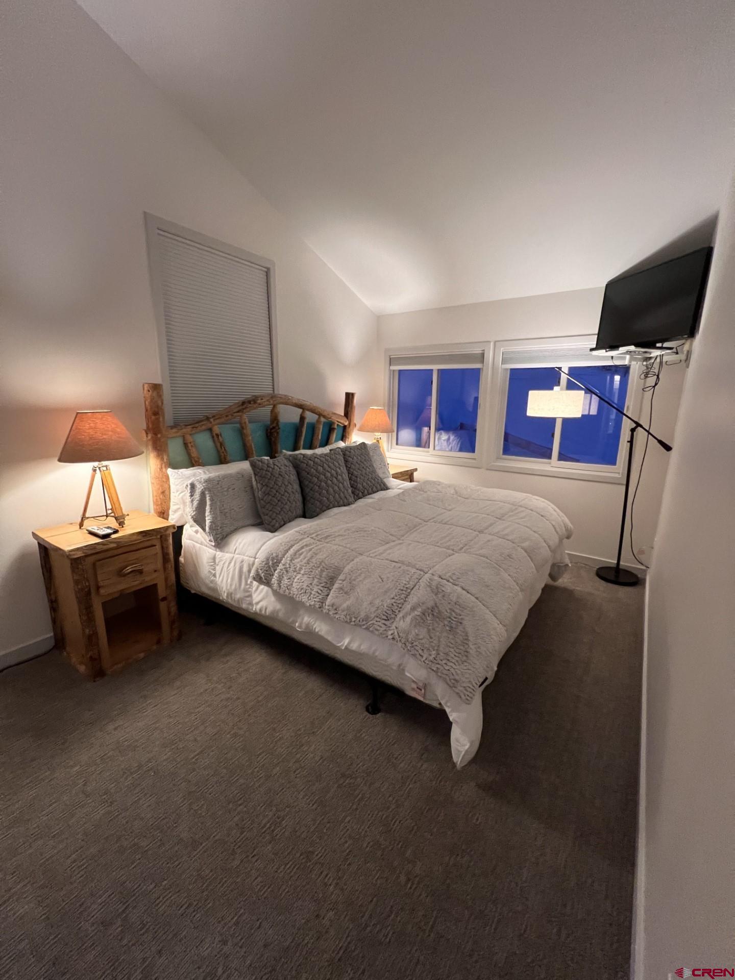 31 Crested Mountain Lane, Unit C2 Crested Butte, CO 81225 - Photo 17 of 25 a bedroom with bed and window