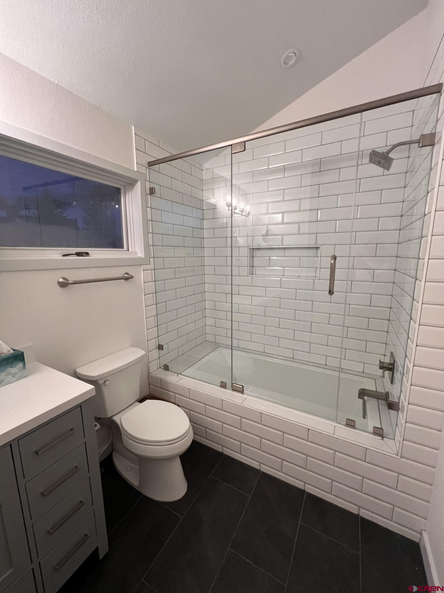 31 Crested Mountain Lane, Unit C2 Crested Butte, CO 81225 - Photo 19 of 25 a bathroom with a sink a toilet and shower
