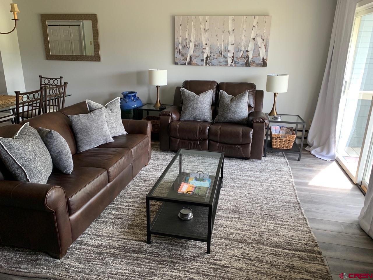 31 Crested Mountain Lane, Unit C2 Crested Butte, CO 81225 - Photo 10 of 25 a living room with furniture and a couch