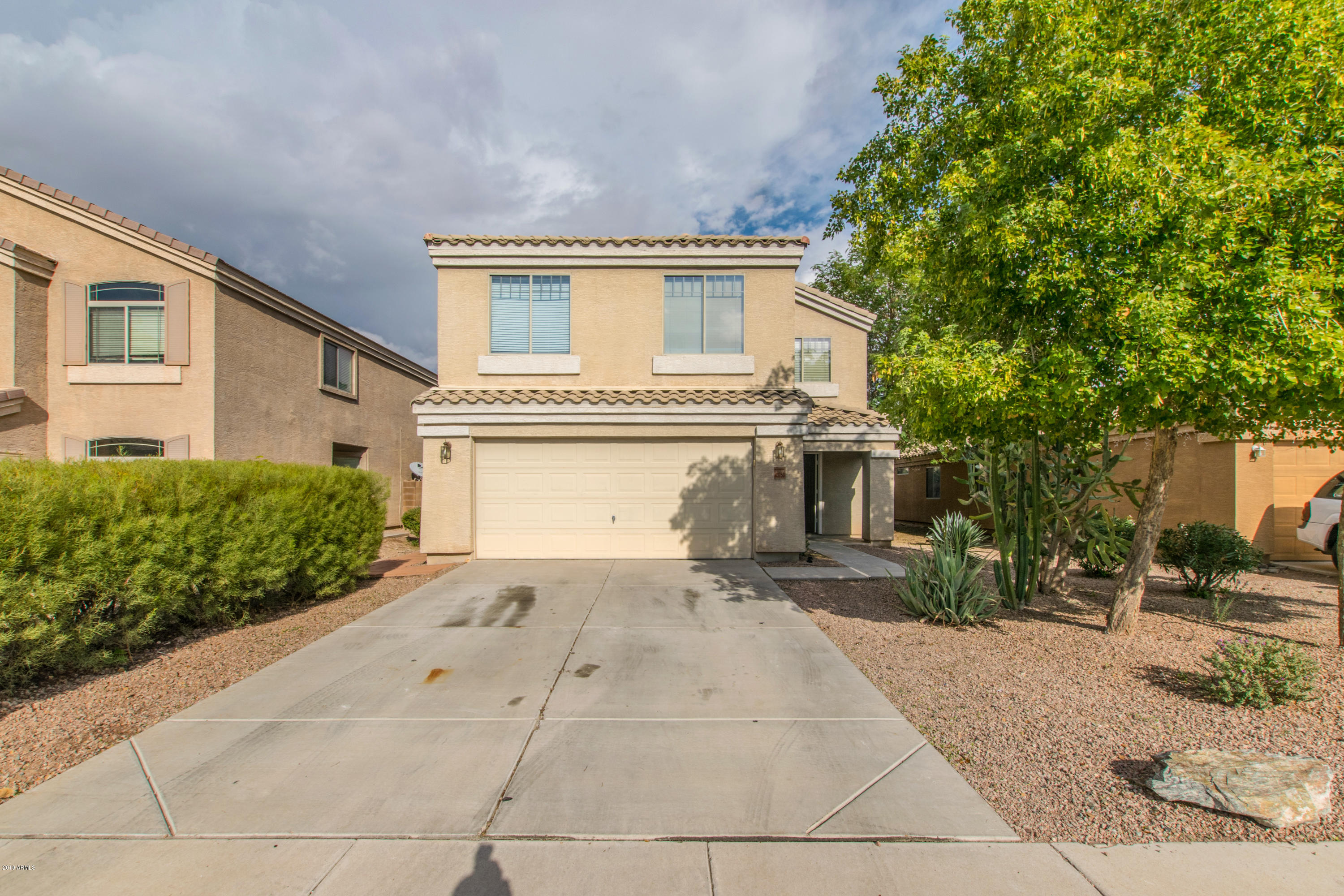 43750 West Magnolia Road Maricopa, AZ 85138 - Photo 1 of 28 front view of a house with a yard