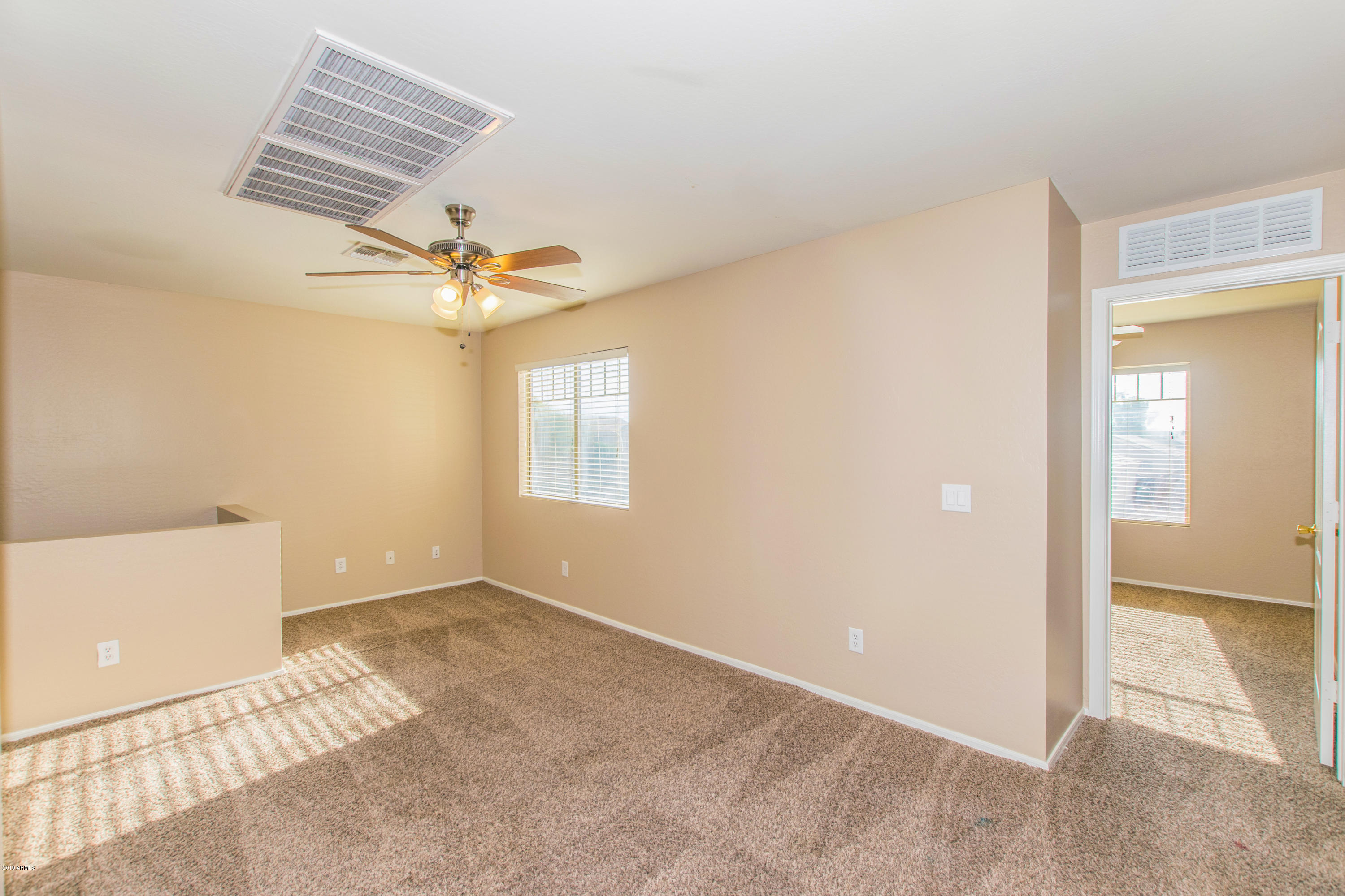 43750 West Magnolia Road Maricopa, AZ 85138 - Photo 11 of 28 a view of room with a ceiling fan