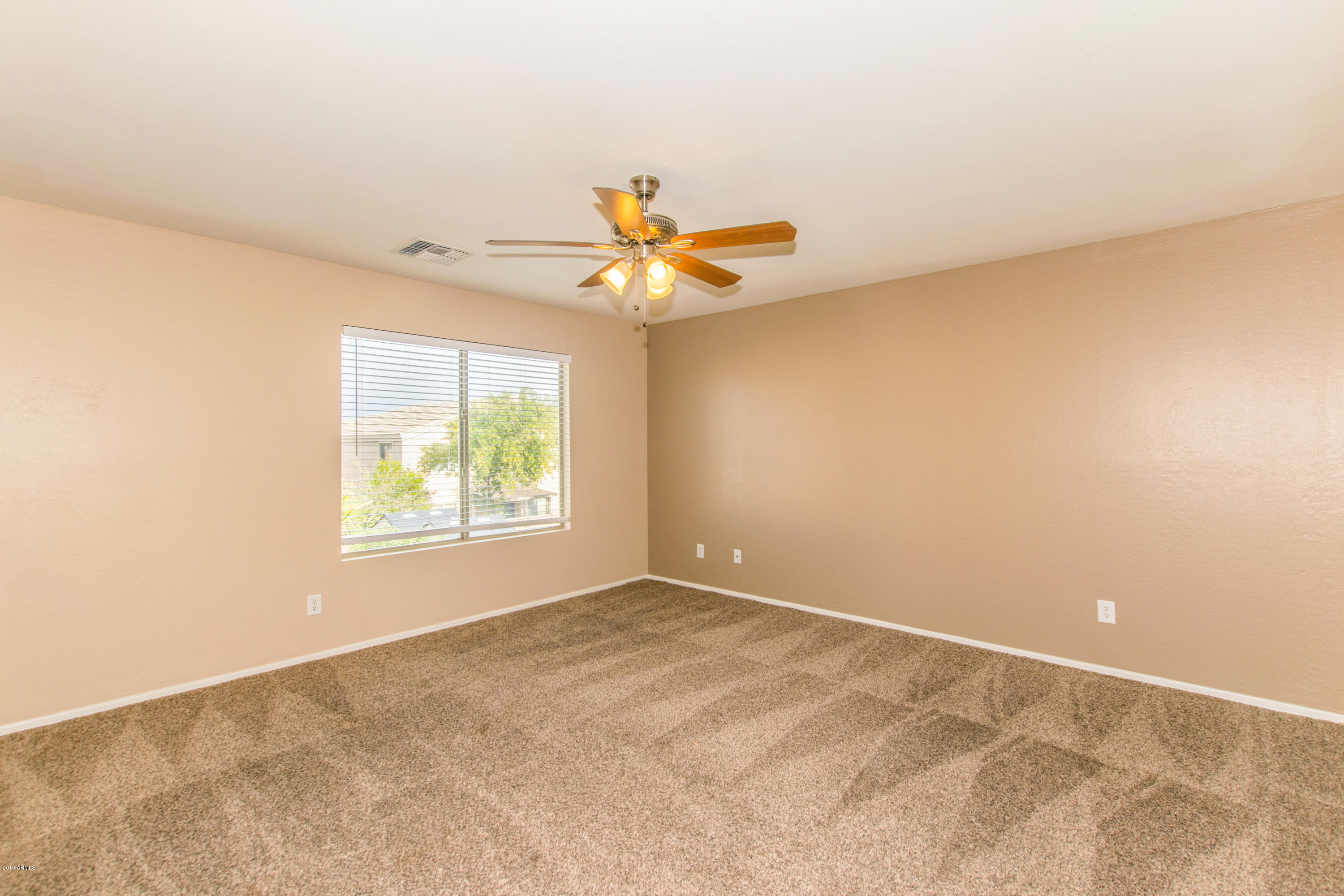 43750 West Magnolia Road Maricopa, AZ 85138 - Photo 13 of 28 a view of an empty room with a window