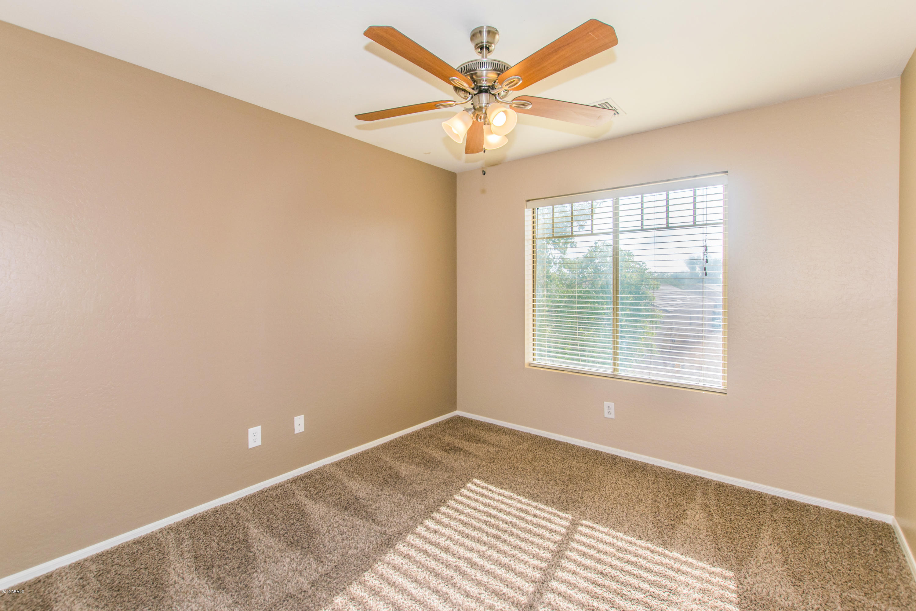 43750 West Magnolia Road Maricopa, AZ 85138 - Photo 17 of 28 an empty room with a window