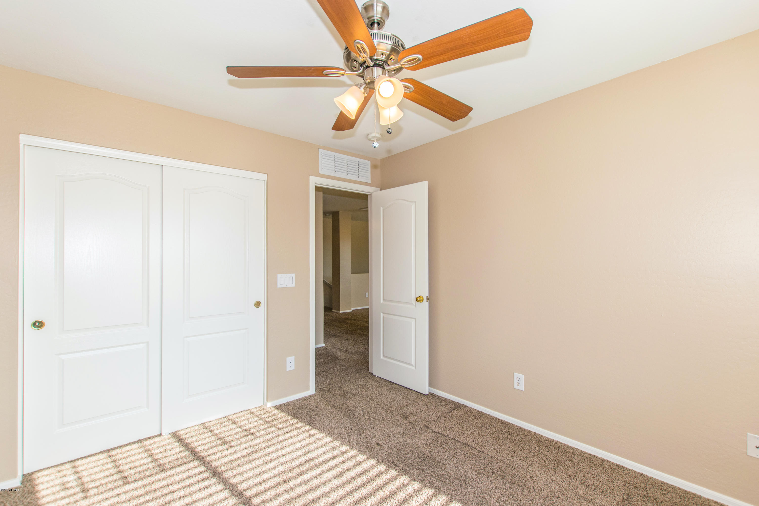 43750 West Magnolia Road Maricopa, AZ 85138 - Photo 22 of 28 a view of a room with a ceiling fan