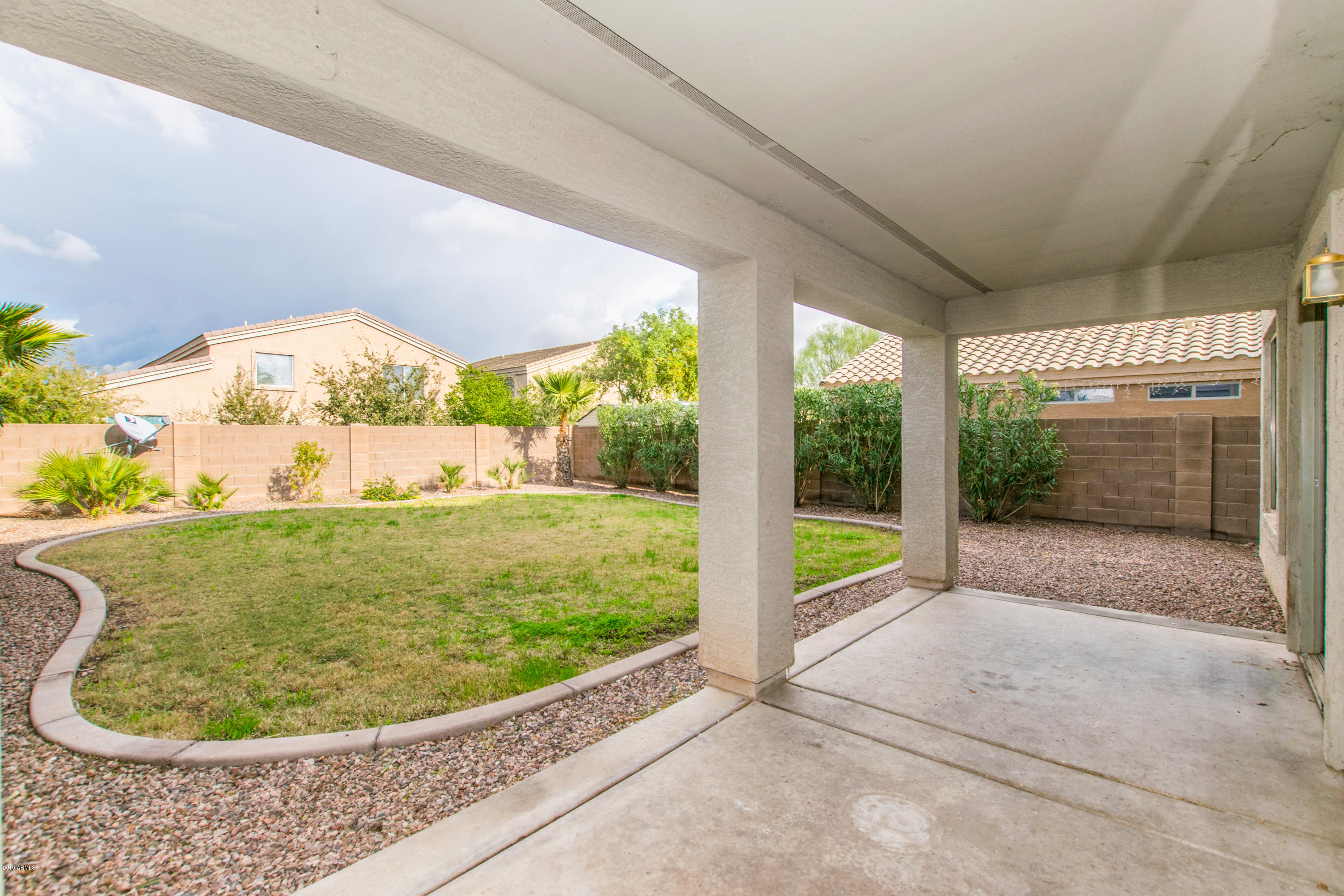 43750 West Magnolia Road Maricopa, AZ 85138 - Photo 24 of 28 a view of a garden with an outdoor space