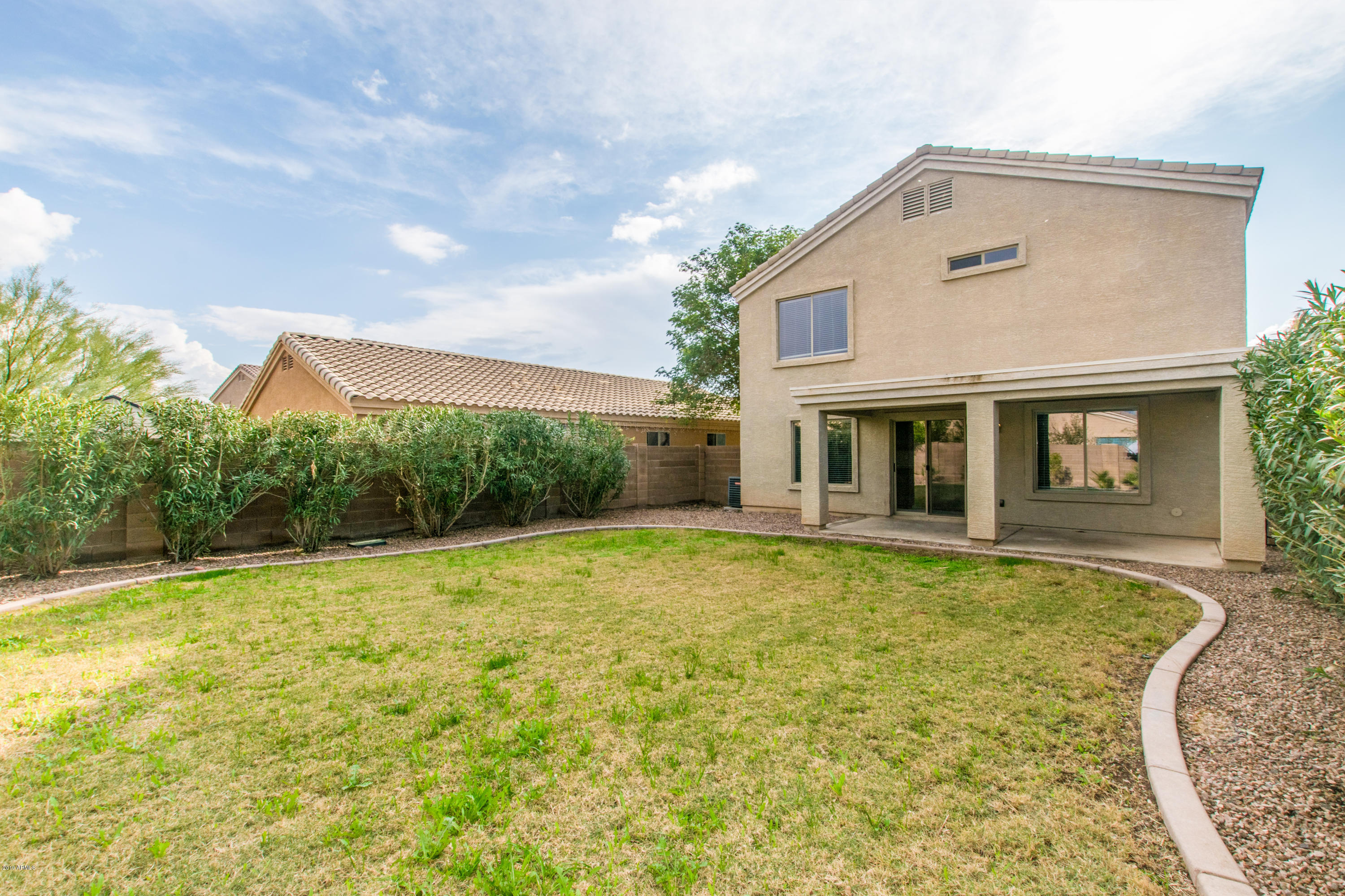 43750 West Magnolia Road Maricopa, AZ 85138 - Photo 28 of 28 a front view of house with yard and green space
