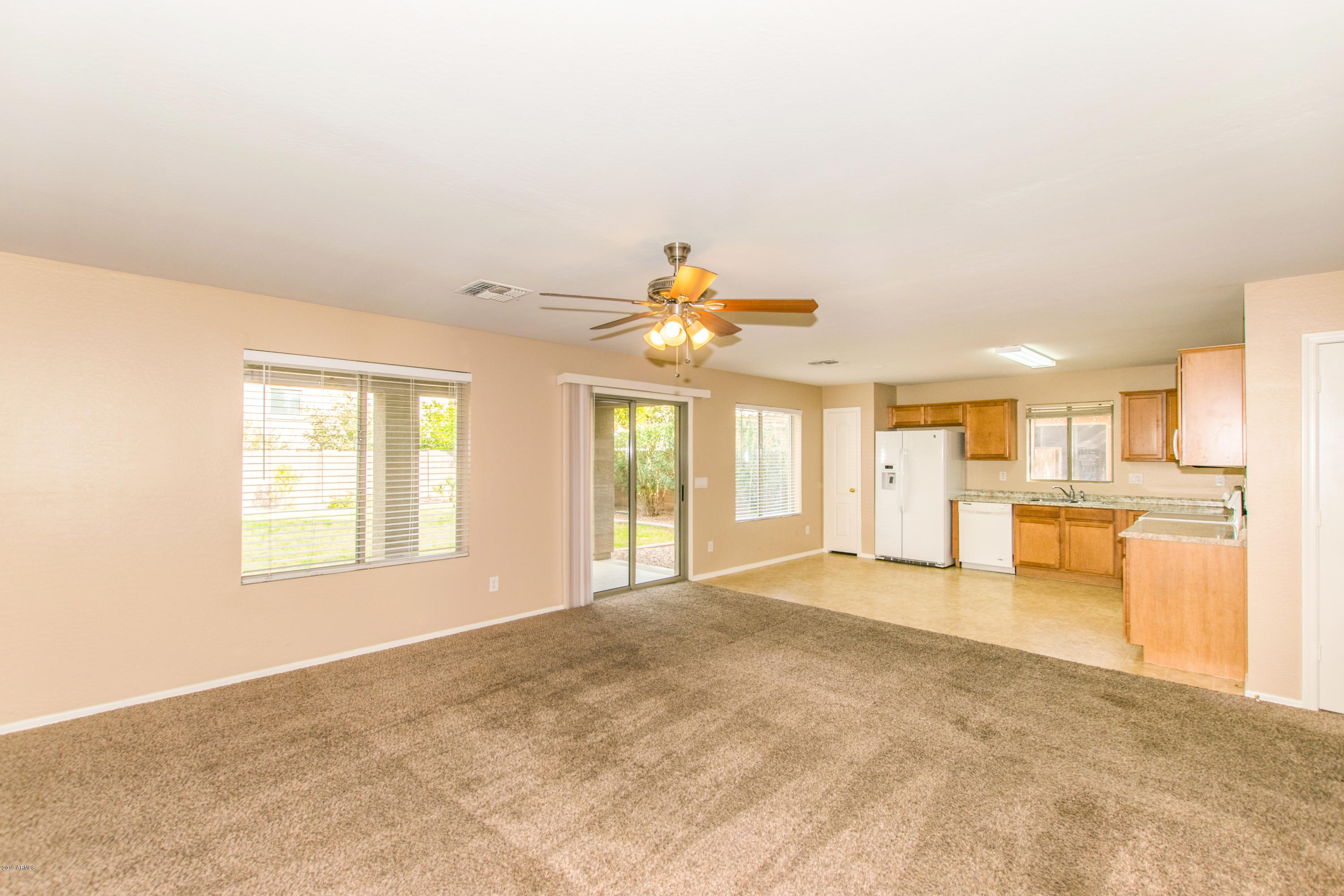 43750 West Magnolia Road Maricopa, AZ 85138 - Photo 6 of 28 a view of an empty room with a window