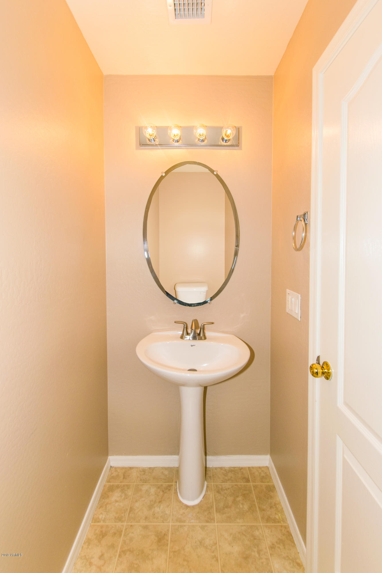 43750 West Magnolia Road Maricopa, AZ 85138 - Photo 10 of 28 a bathroom with a sink a toilet and shower