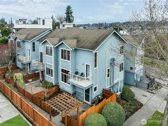 an aerial view of a house with a yard