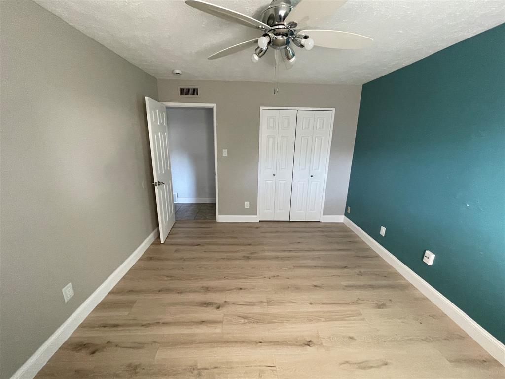 3732 Pinewood Street Bedford, TX 76021 - Photo 17 of 18 a view of an empty room with wooden floor