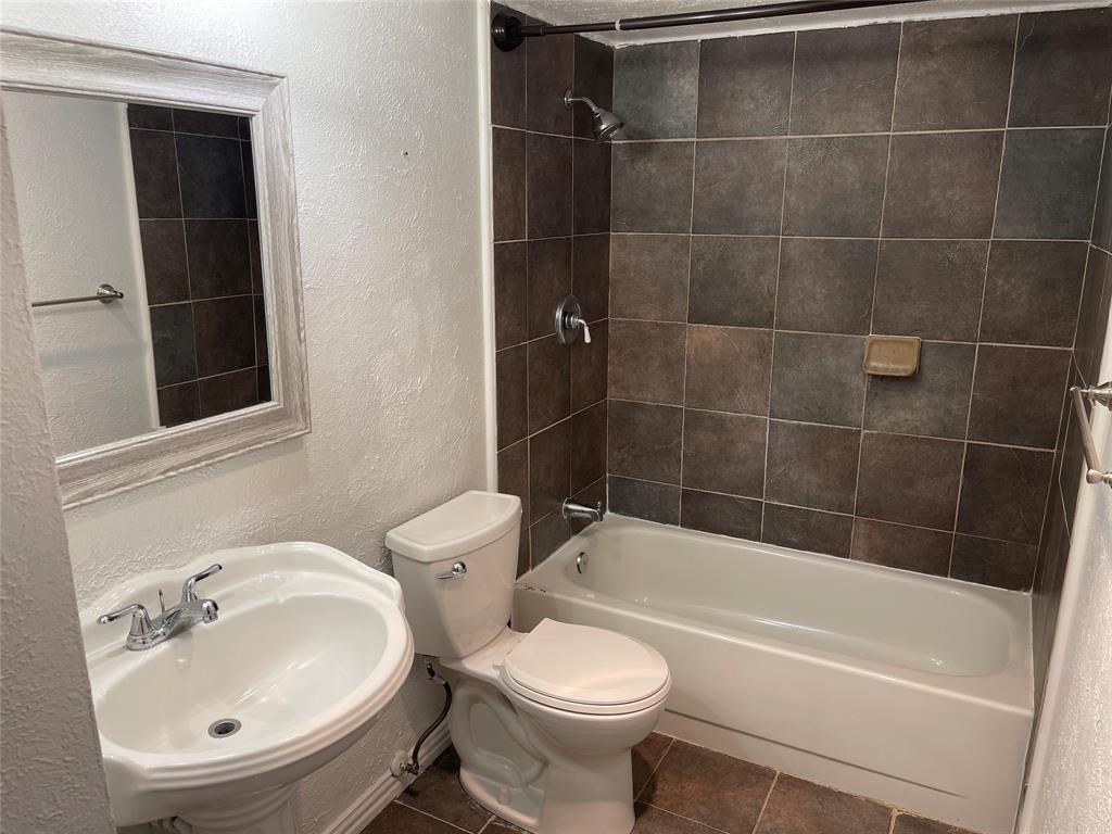 3732 Pinewood Street Bedford, TX 76021 - Photo 18 of 18 a bathroom with a sink toilet and shower