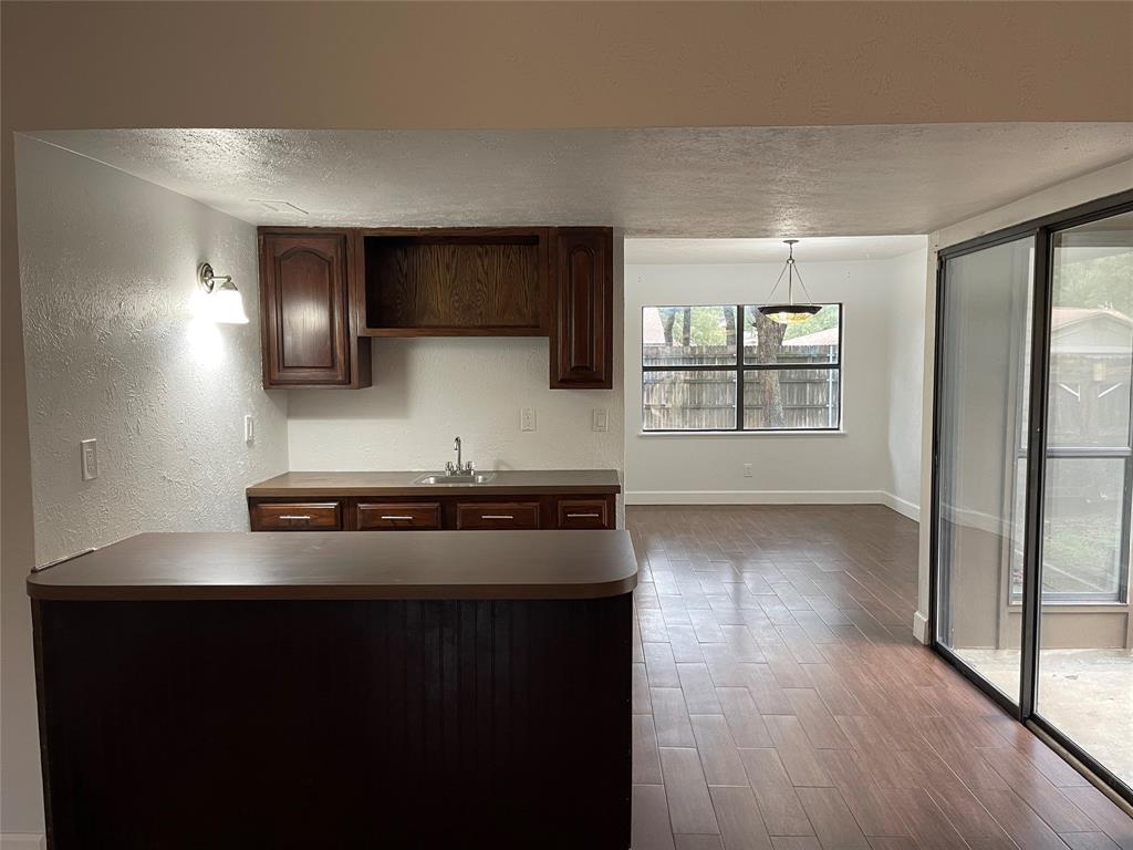 3732 Pinewood Street Bedford, TX 76021 - Photo 5 of 18 a kitchen with stainless steel appliances granite countertop a stove and a refrigerator
