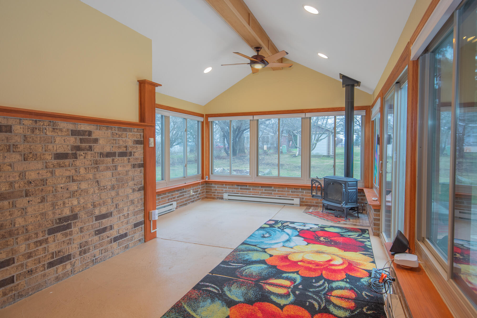4024 South Brook Road Caledonia, WI 53126 - Photo 8 of 66 Four Season Room with vaulted ceiling and ceiling fan