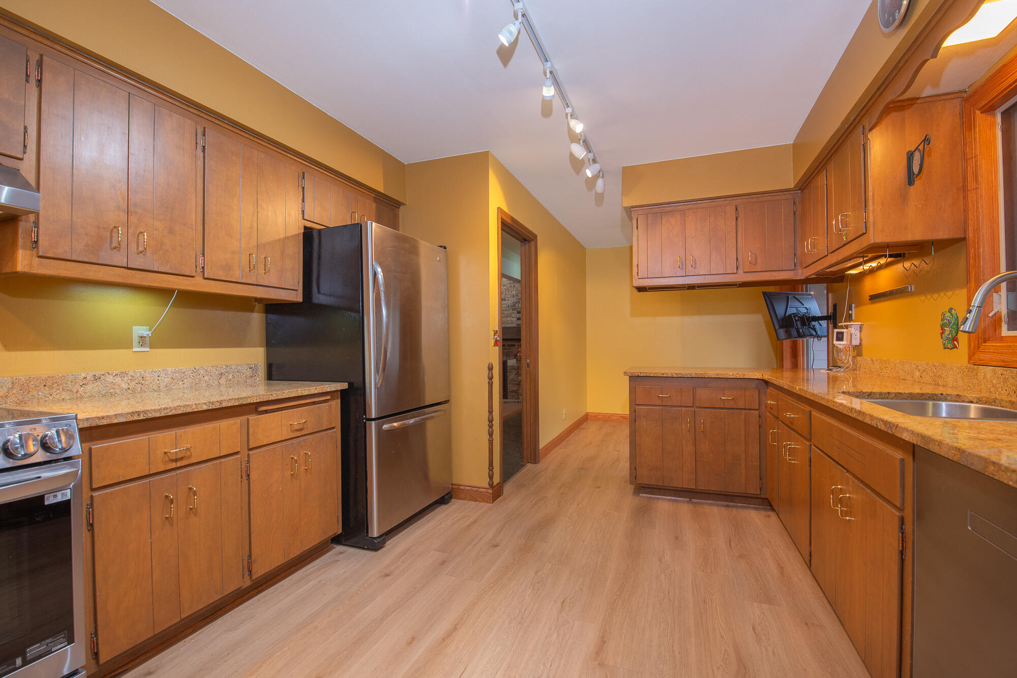 4024 South Brook Road Caledonia, WI 53126 - Photo 10 of 66 Kitchen with stainless steel appliances including induction stove and dishwasher new in 2024