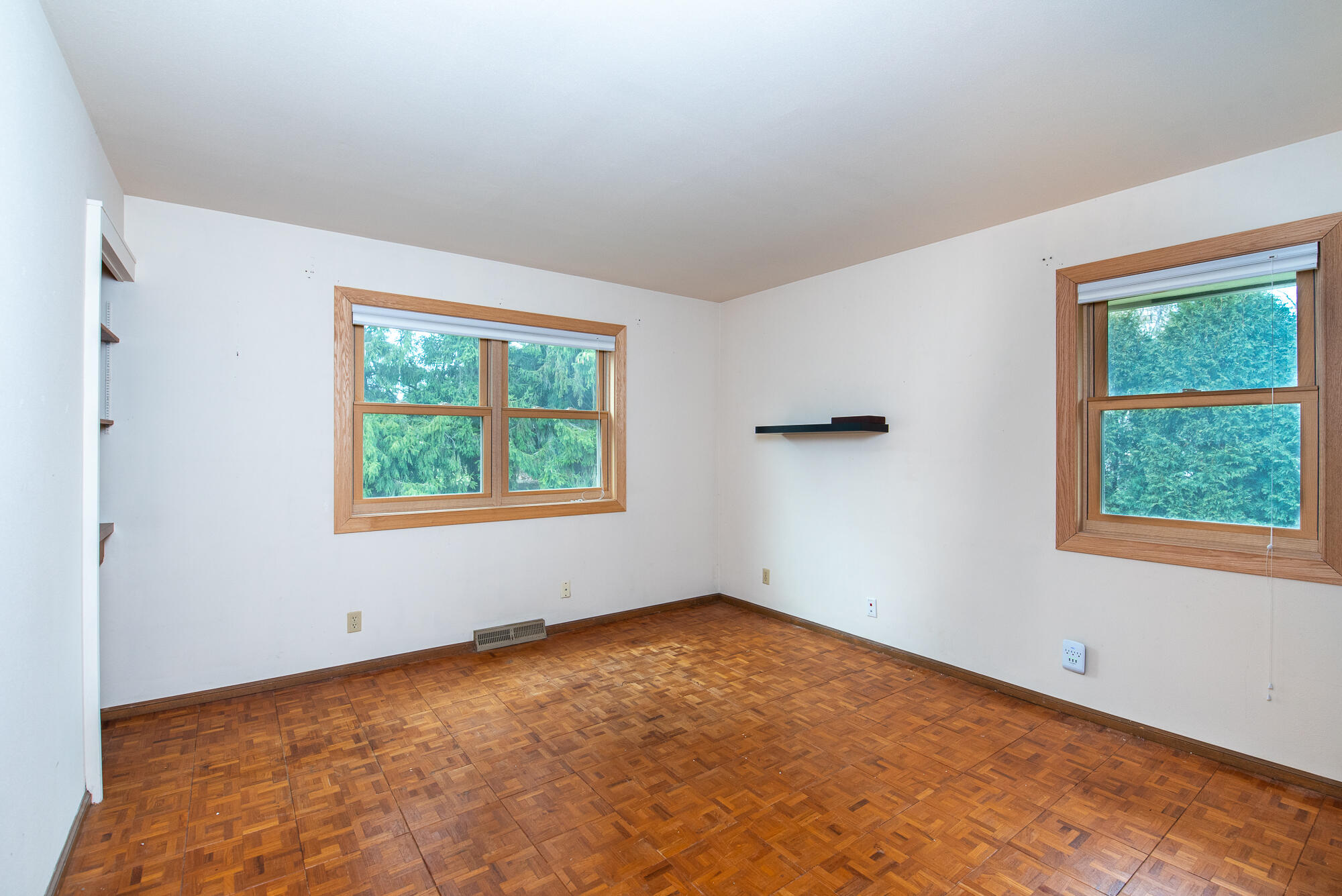4024 South Brook Road Caledonia, WI 53126 - Photo 24 of 66 Wood floored Bedroom Two on main level with north and west facing windows