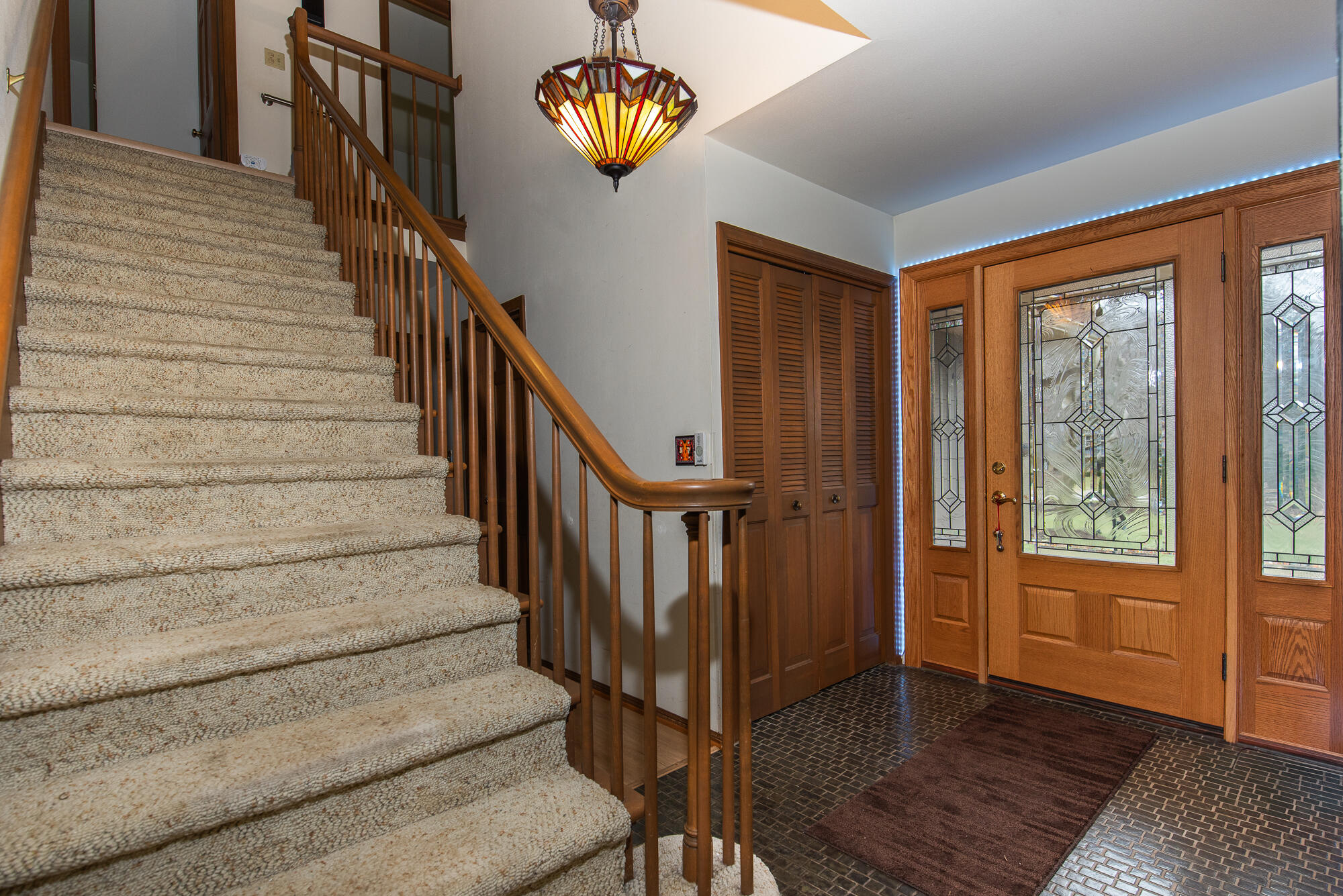 4024 South Brook Road Caledonia, WI 53126 - Photo 35 of 66 Front entry hallway with tiled floor and coat closet